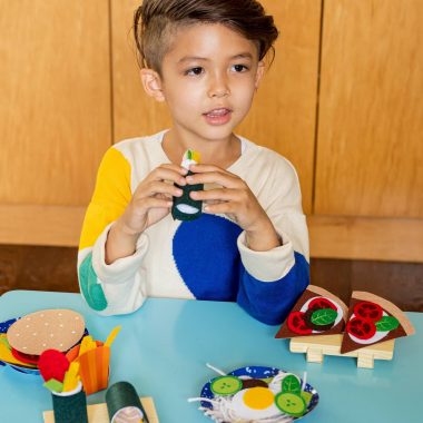Child with Early Explorers food activity