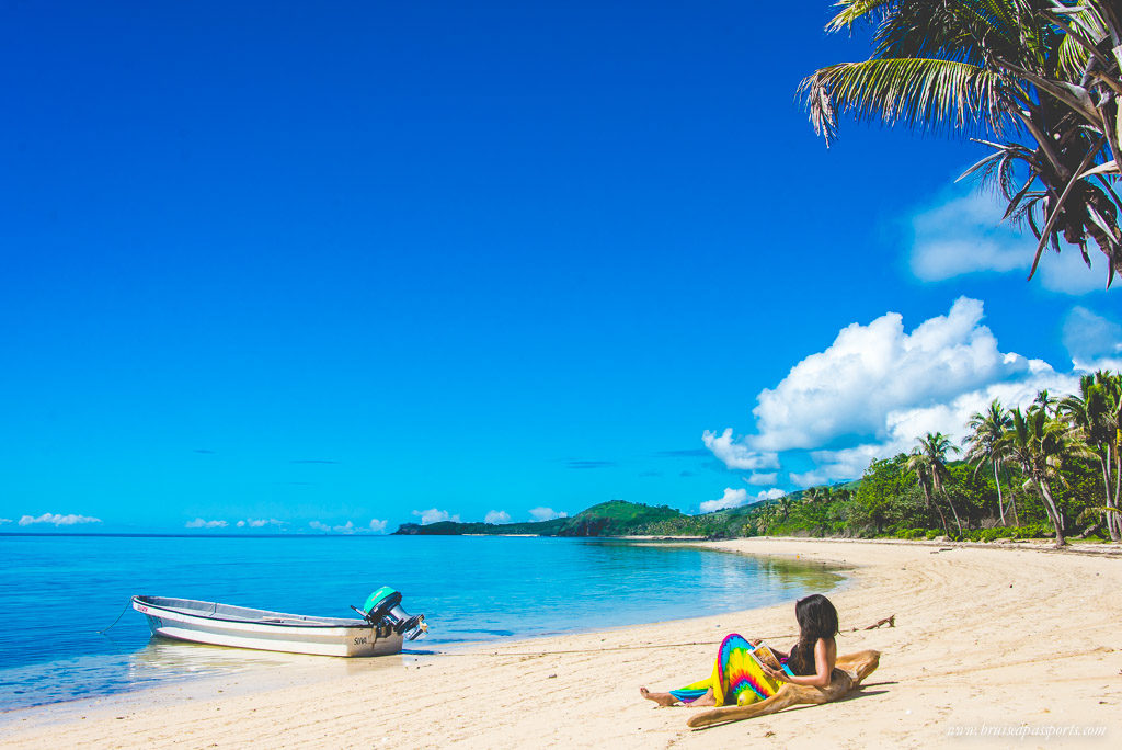 girl on deserted beach in Fiji during one week trip