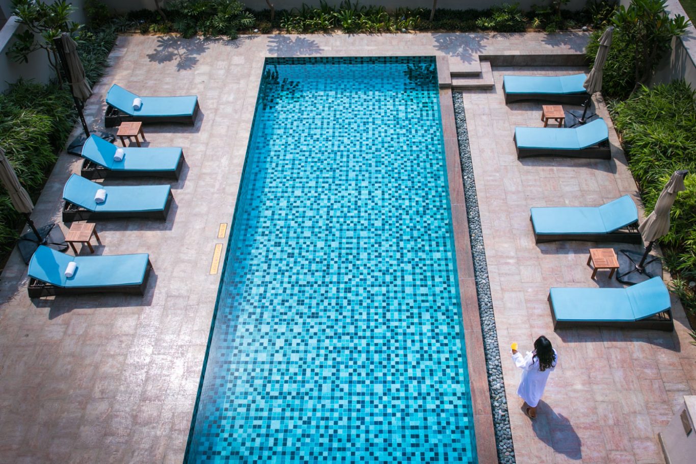 girl at pool at andaz delhi