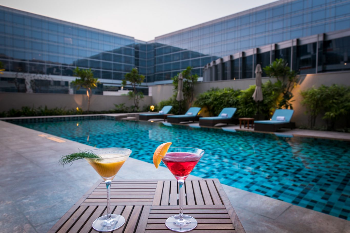 Cocktails by the pool at Andaz Delhi 