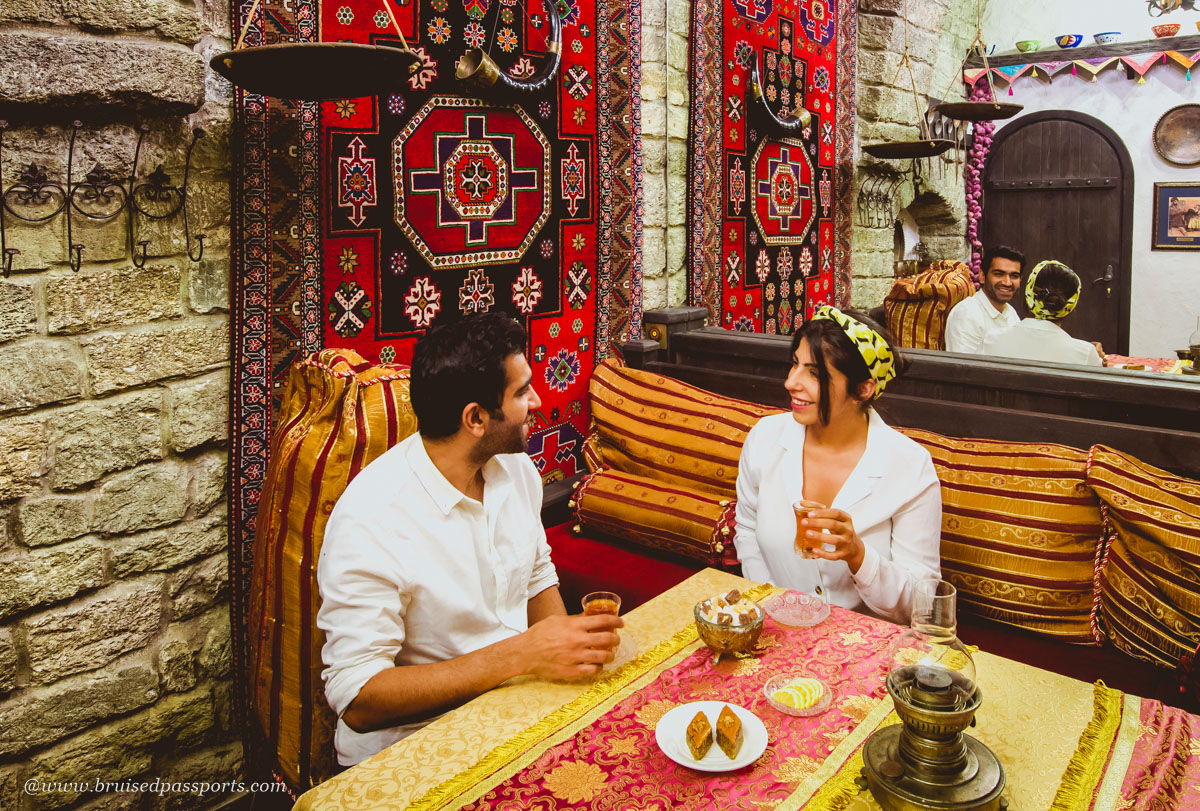 carpets and middle eastern decor in a dining room at Shirvanshah Museum Restaurant