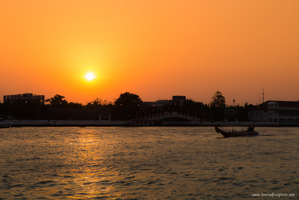 A leisurely walk along the river at sunset