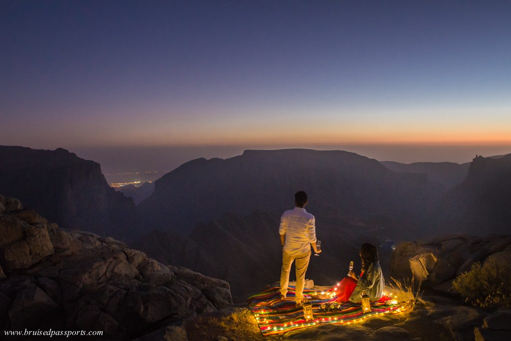 Couple enjoying tea at sunset in Oman