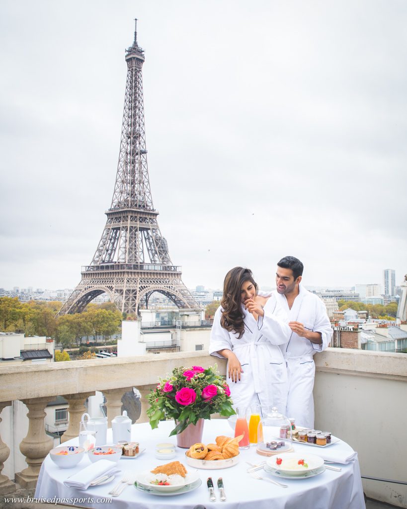 Couple enjoying breakfast with a view of Eiffel Tower