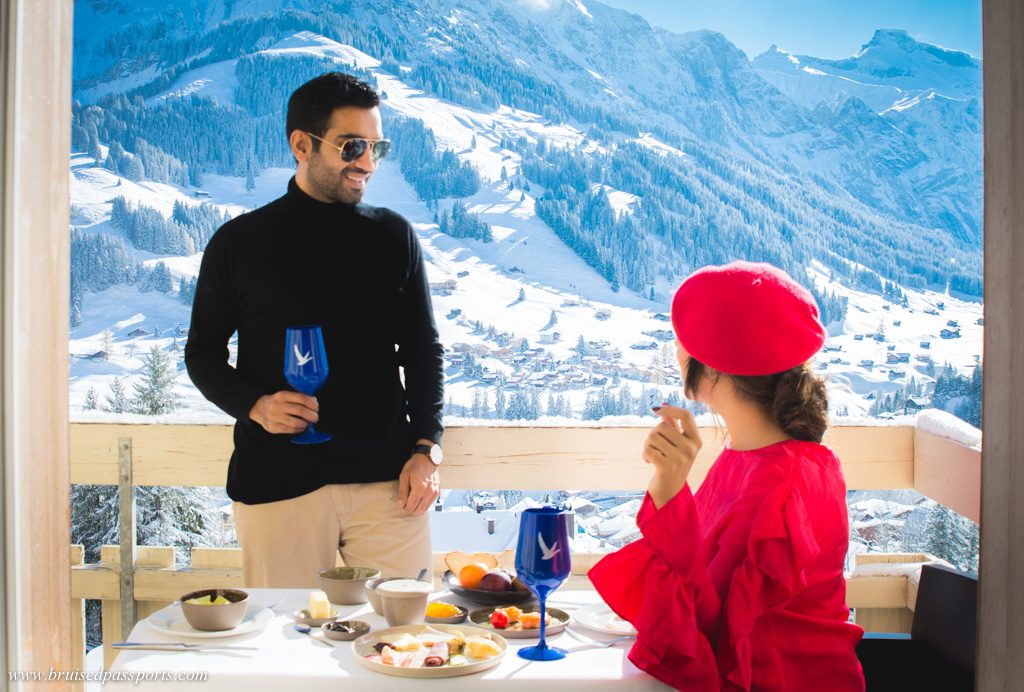 couple enjoying breakfast in snow at Adelboden, Switzerland