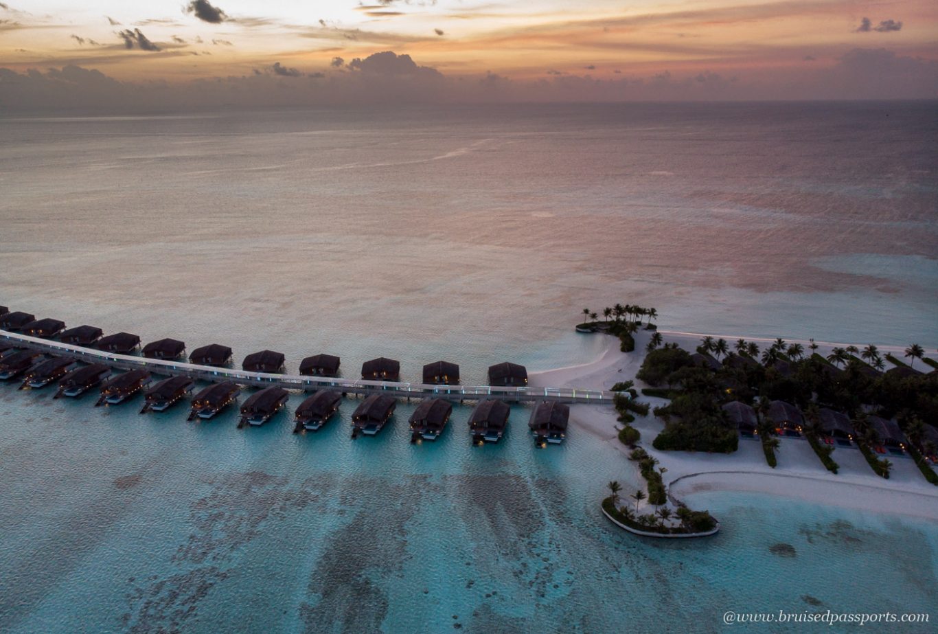 Drone shot of Sunset at Club Med Finolhu Maldives 