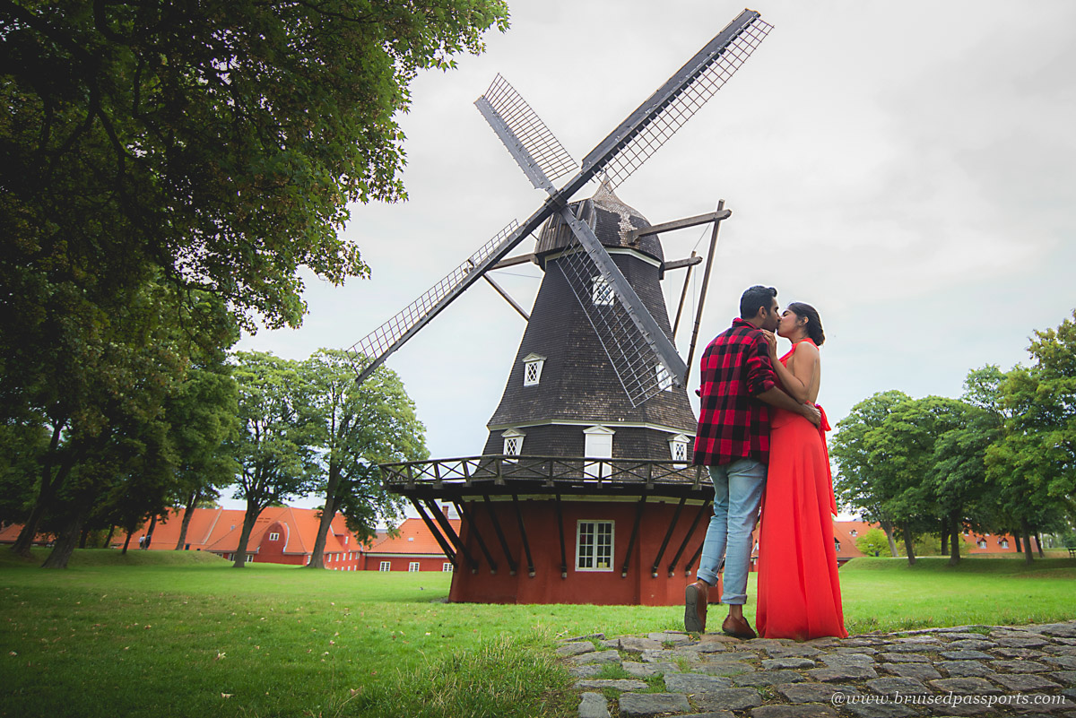 A couple near the windmill at Kastellet in Copenhagen