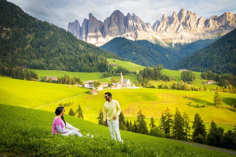 Couple at Dolomites view point in Santa Maddalena