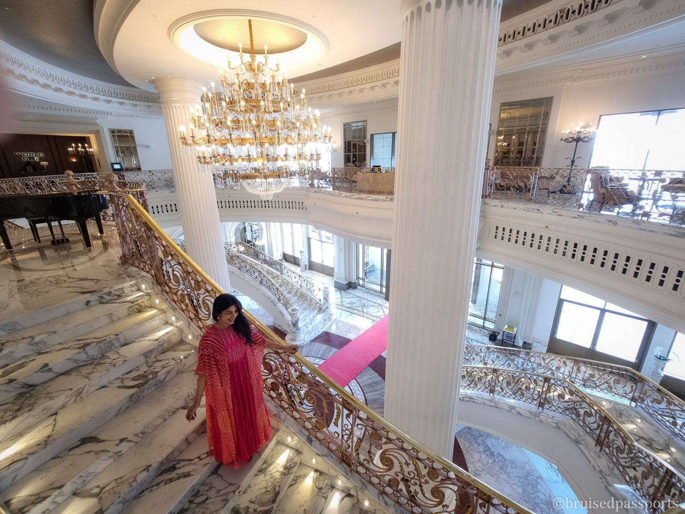 Girl on staircase at Habtoor Palace Hotel dubai 