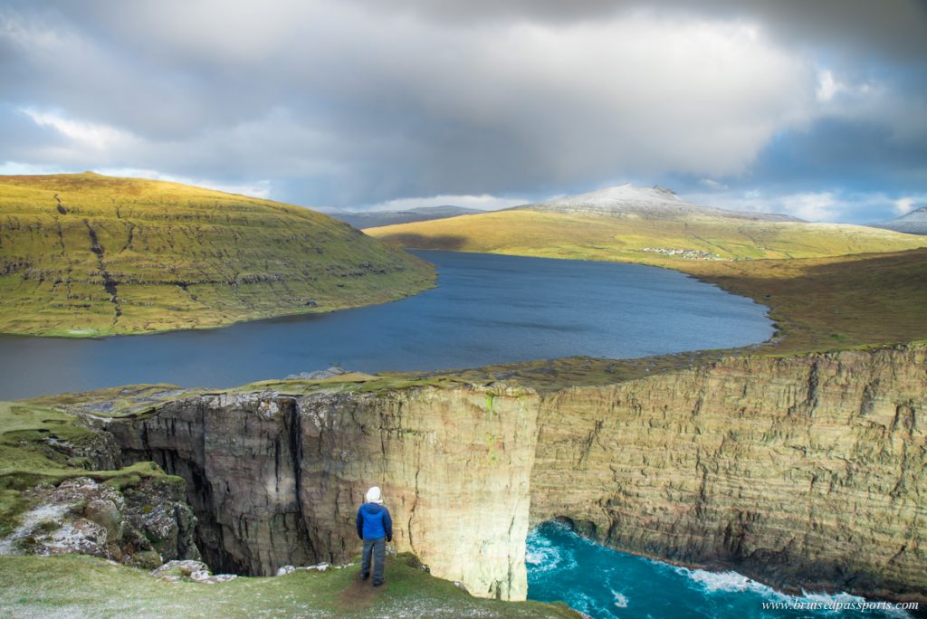 Traelanipa cliff in Vagar island of Faroe Islands where lake appears above ocean