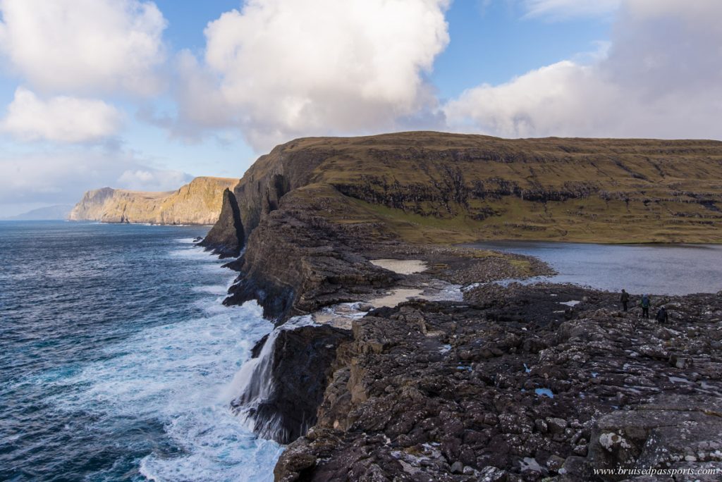 Bøsdalafossur waterfall at the edge of a lake in Faroe Islands