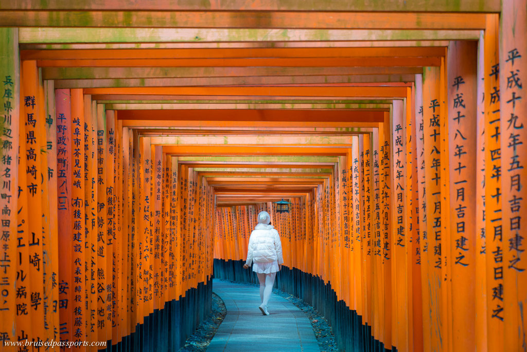 Girl in Inari shrine in Kyoto