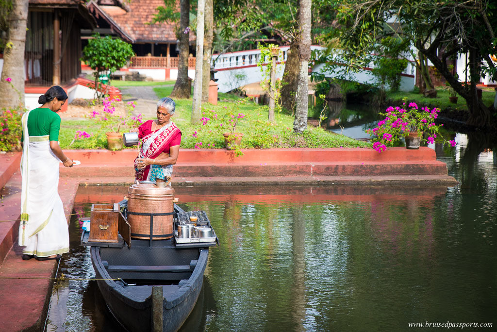 cgh coconut lagoon kerala tea lady in a boat