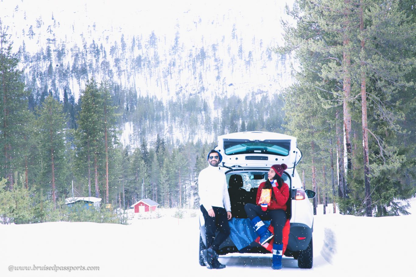 Couple on a road trip in Lapland Finland