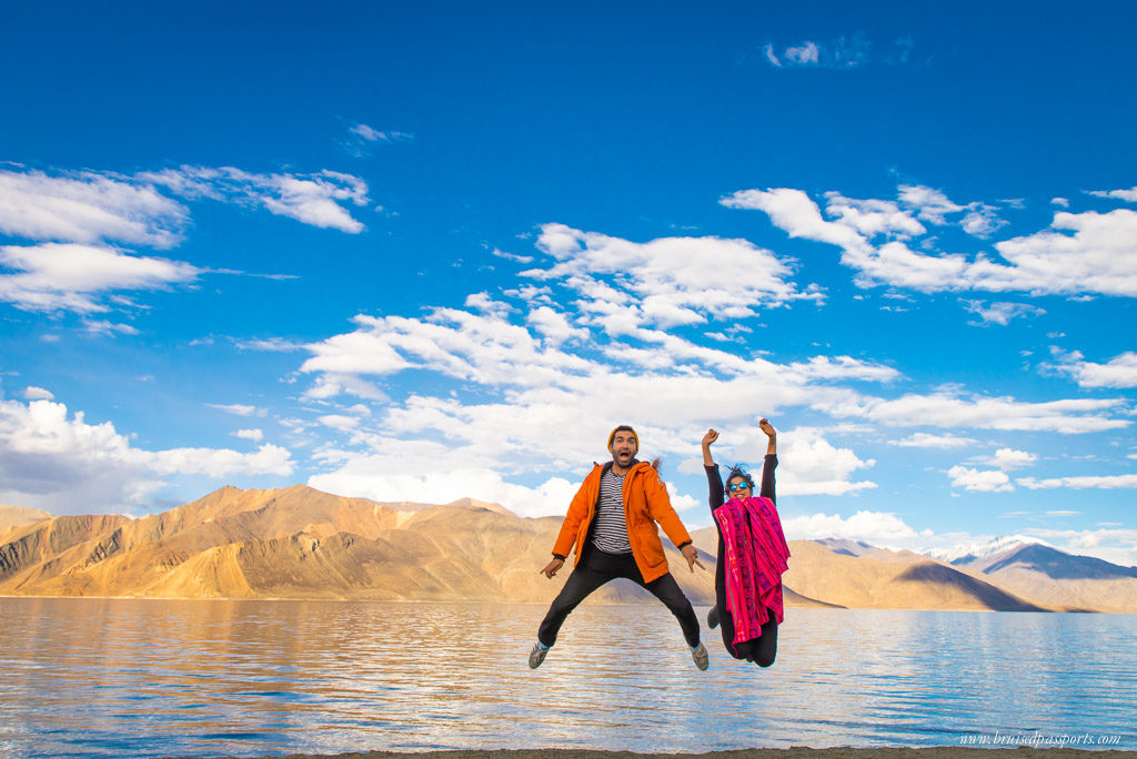 Ladakh road trip couple at Pangong Lake