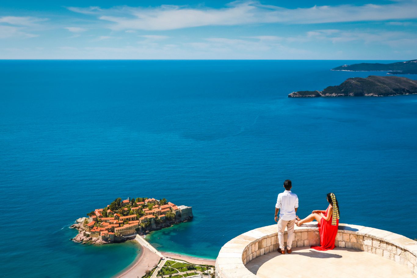 couple at Blizikuce church at vantage point of Sveti Stefan