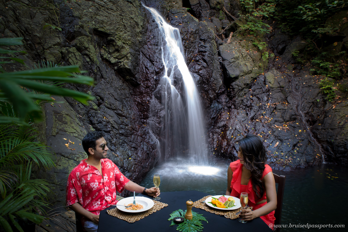 Couple having lunch by waterfall at Namale Resort and Spa Fiji