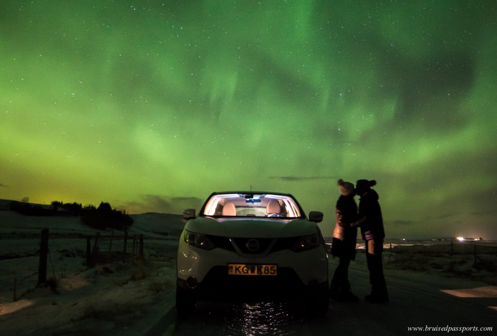 Couple under Northern Lights in ICeland