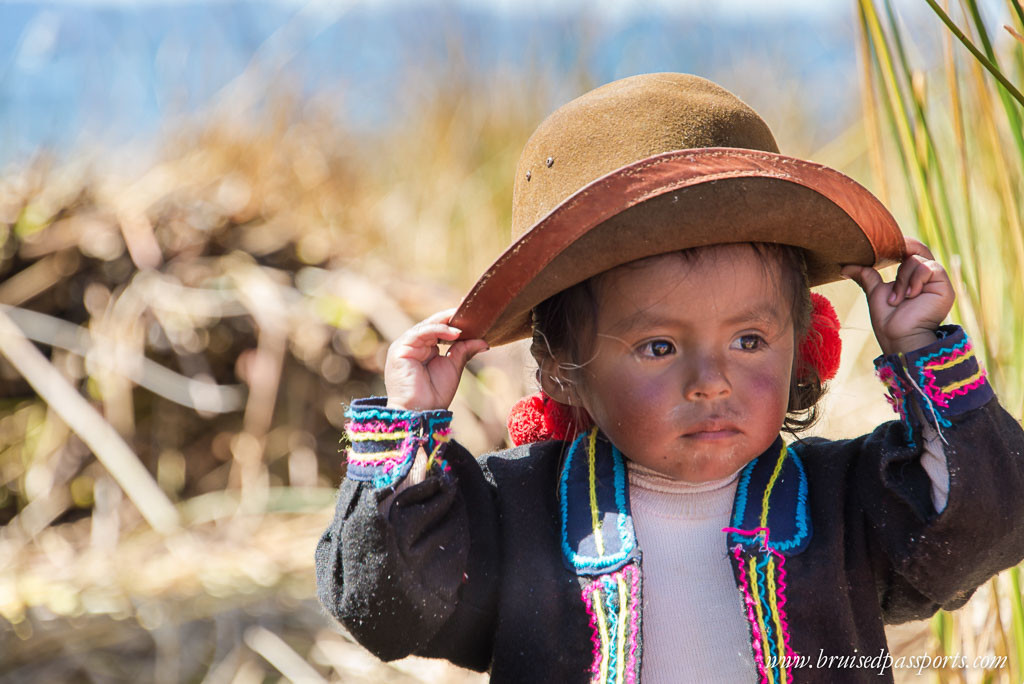 Peru Itinerary-South America-lake-titicaca-uros-islands-baby