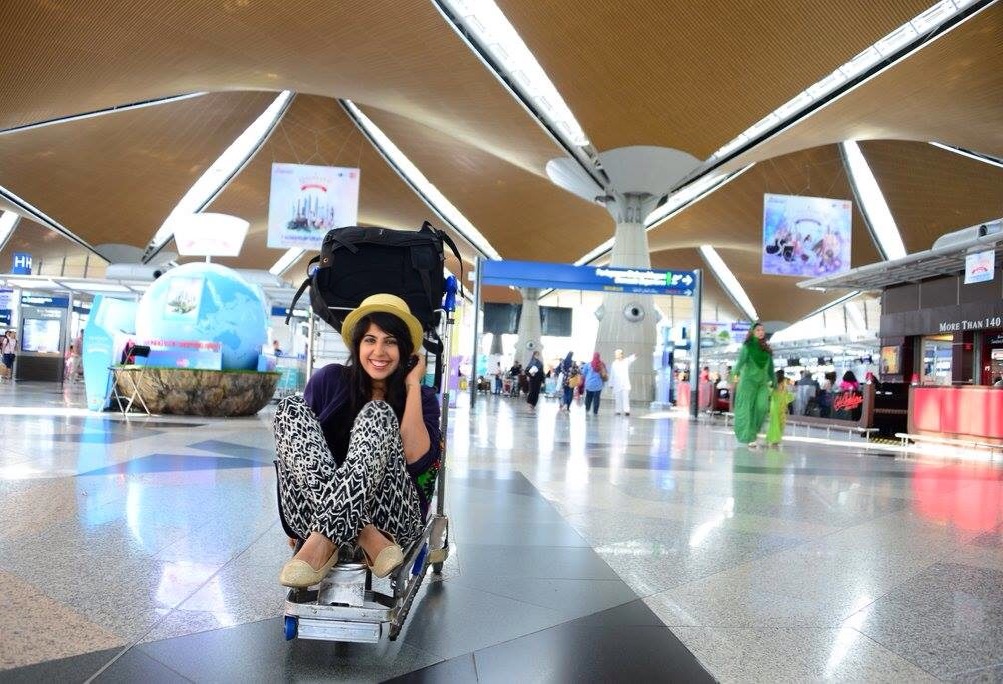 girl on a trolley at airport The things I have to do to stay married to this girl ;-) She dislikes diamonds but wants a 'trolley ride' around the airport before EVERY flight. Sigh!