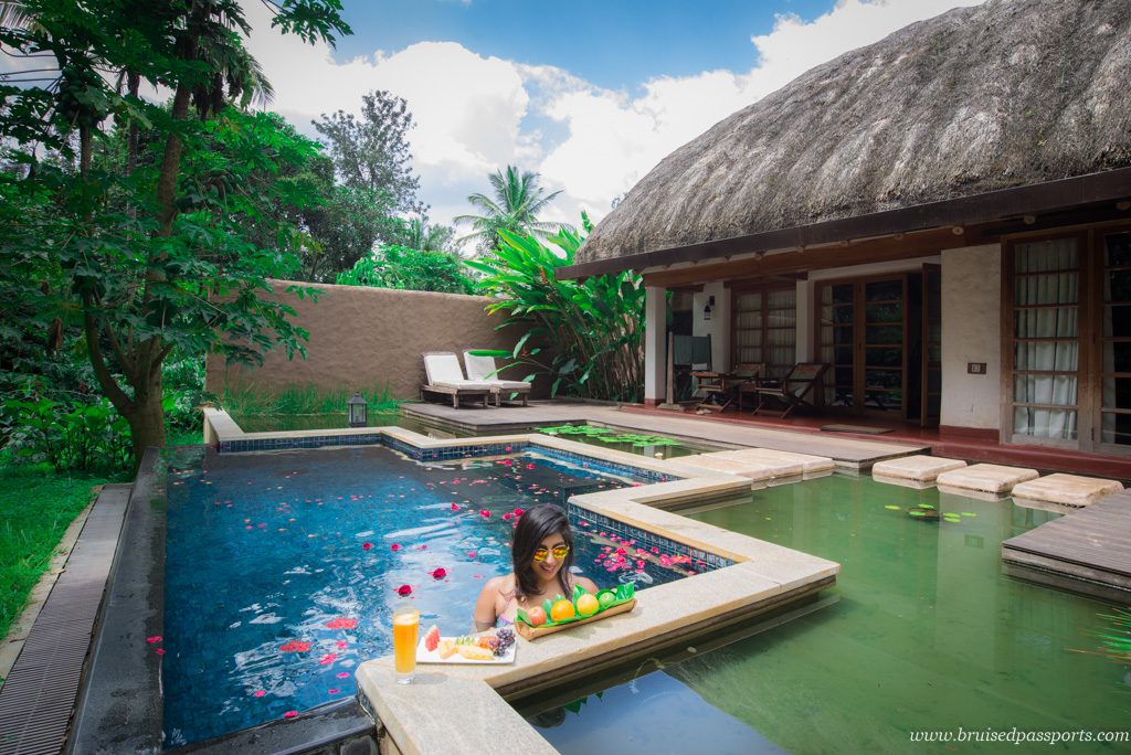 Girl in private pool at Orange County Evolve Back, Coorg