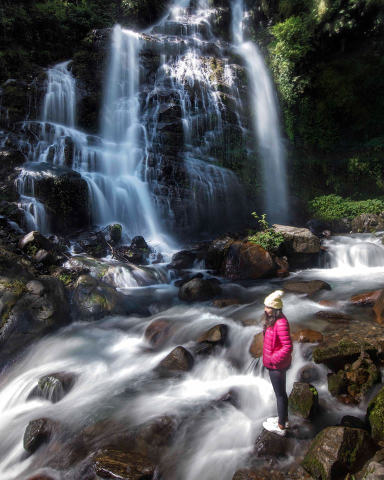 Girl at Kanchenjunga waterfalls in West Sikkim near Pelling