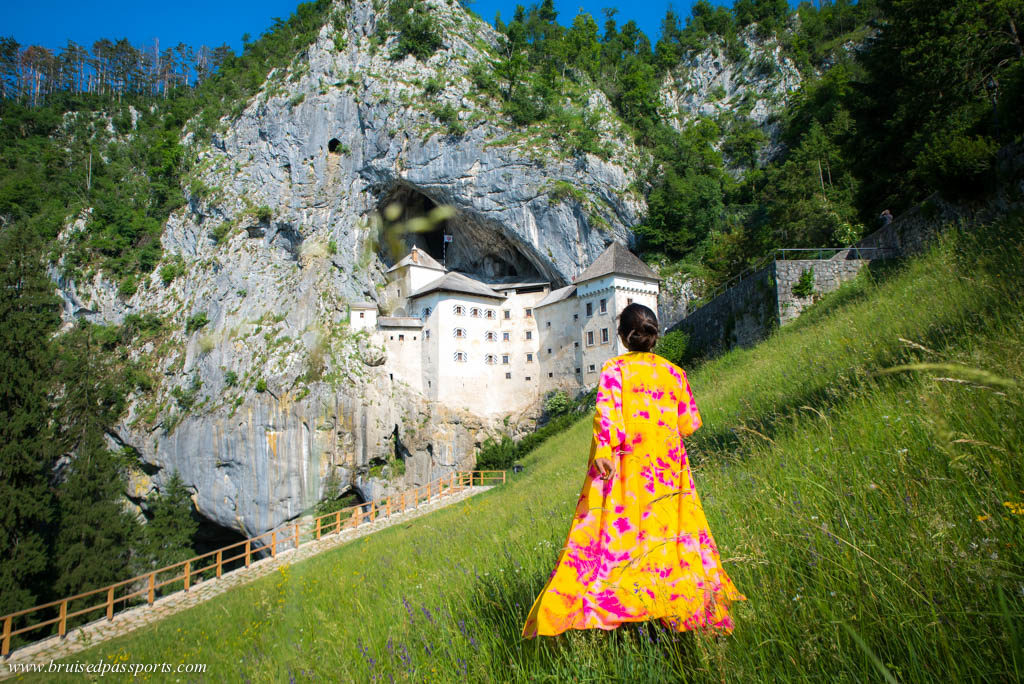 Girl at Predjama castle in Slovenia