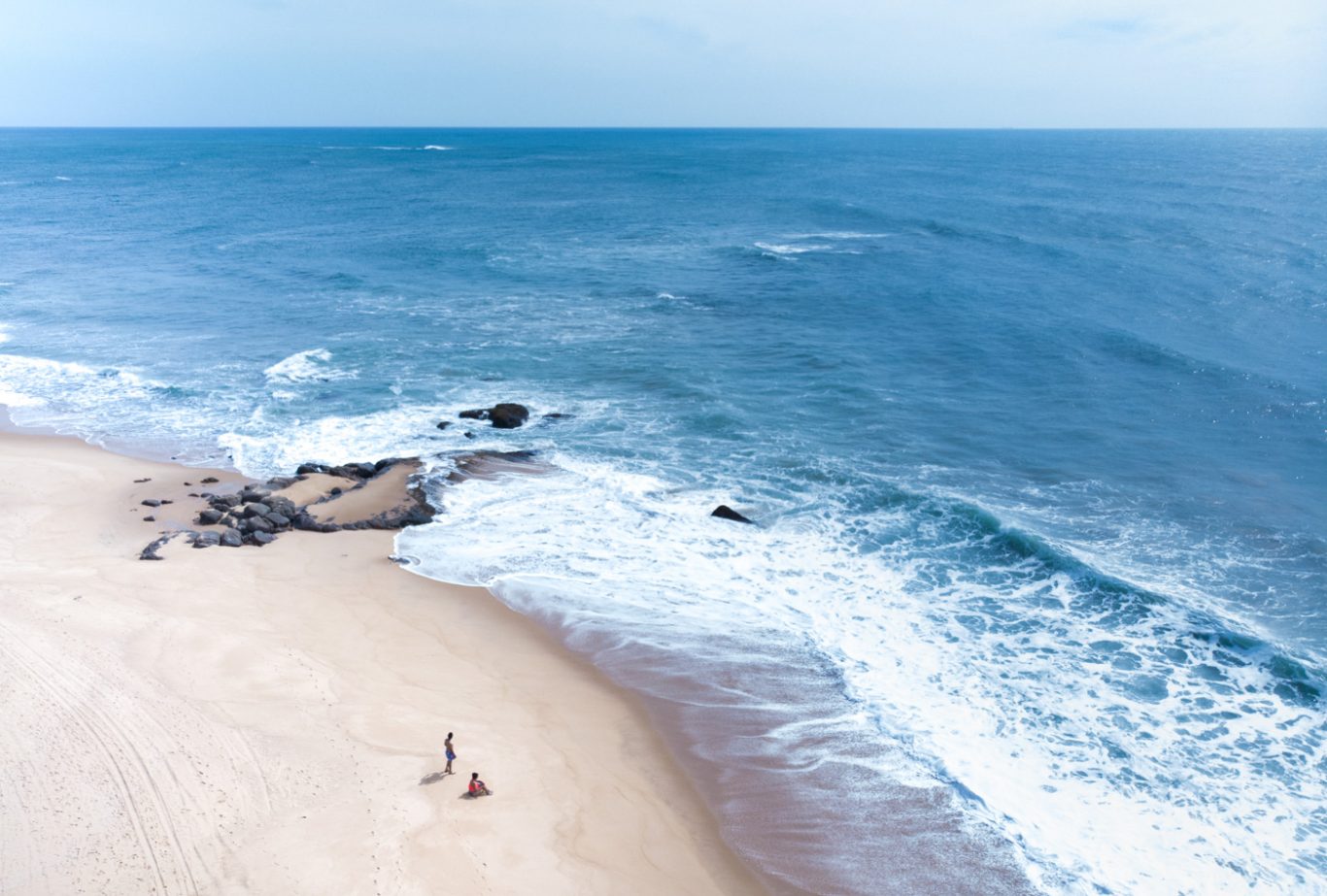 Drone shot of couple on the beach in Sri Lanka