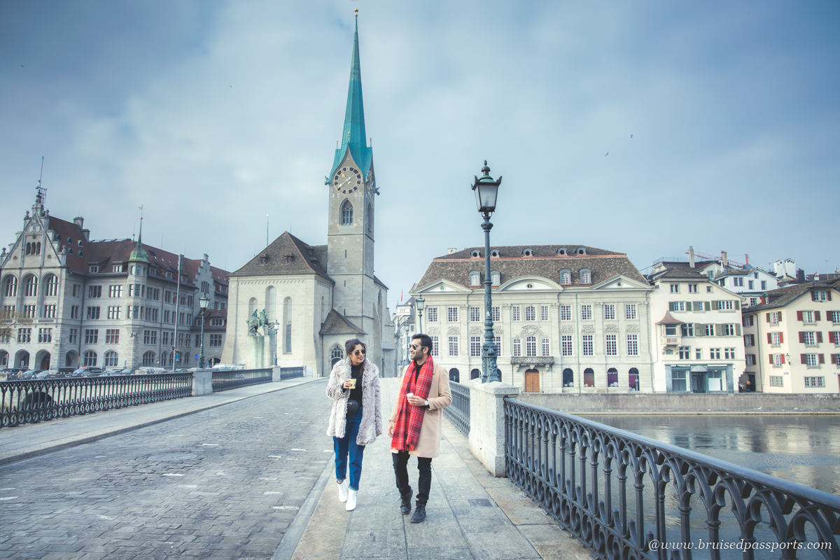 couple walking on bridge in Zurich