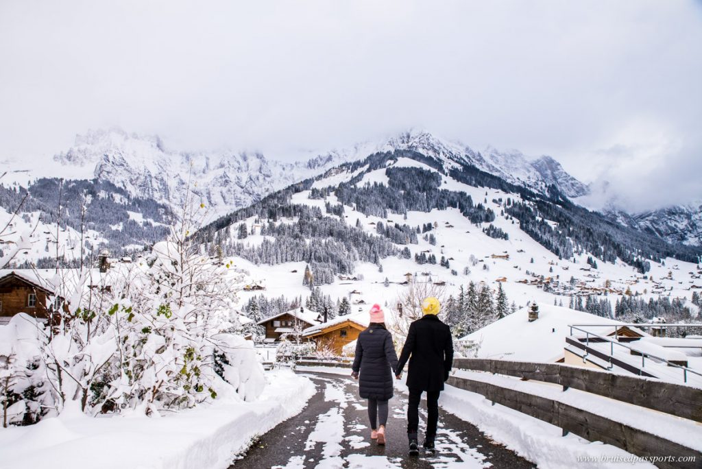 Couple walking in the village of Adelboden in Switerland