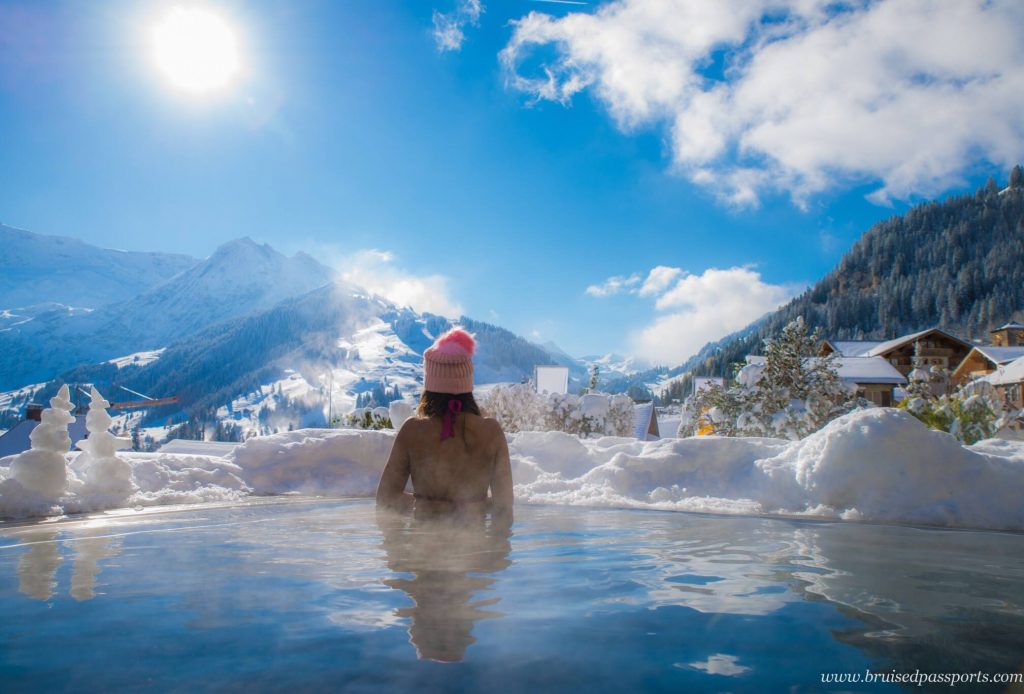 girl in infinity pool in switzerland