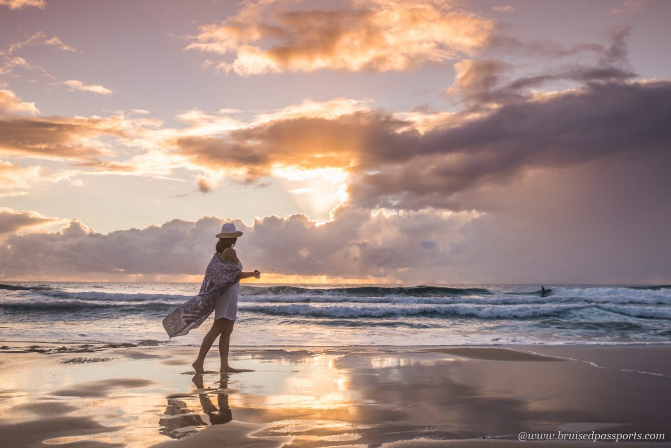 Girl at Surfers Paradise beach at sunrise