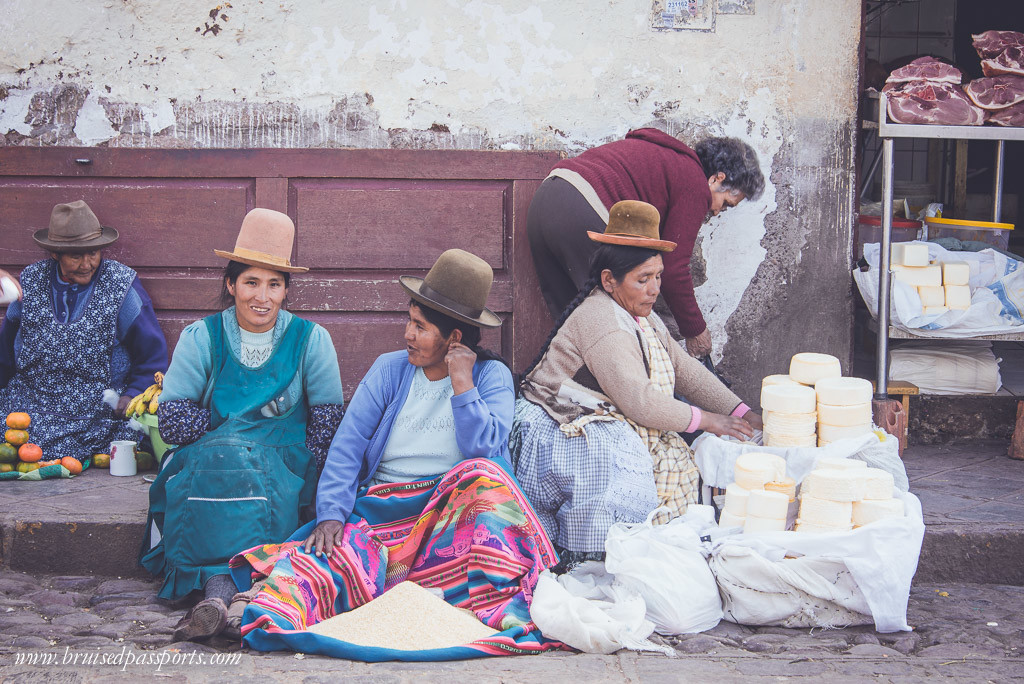 Women selling whole grains at a local market in Peru