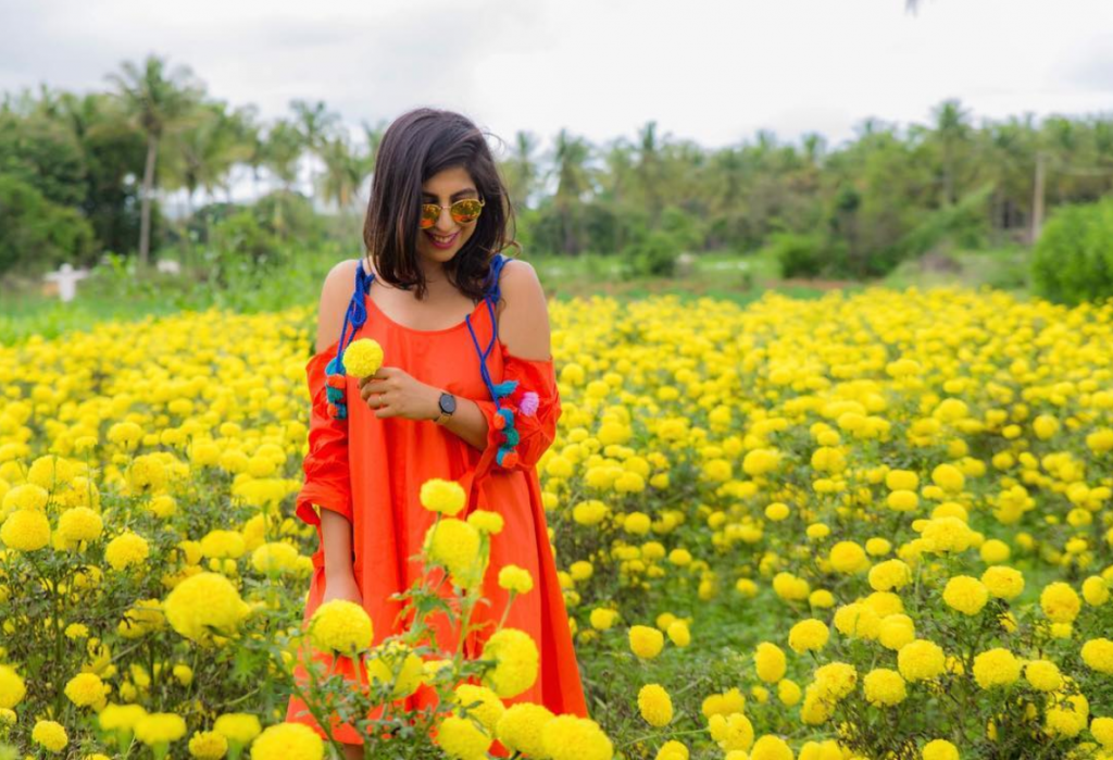 girl in flower field photoshoot fashion karnataka